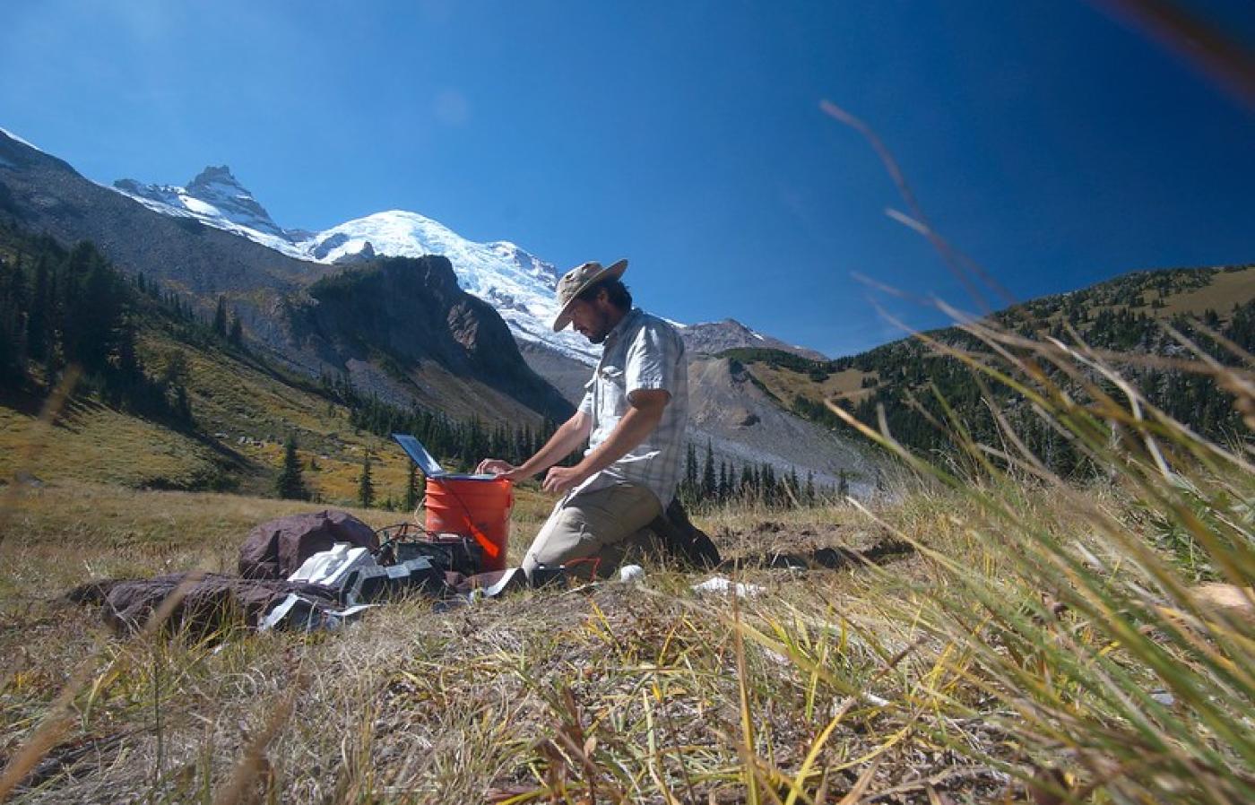 Esteban Bowles-Martinez configuring instrumentation in the field near Mt. Ranier