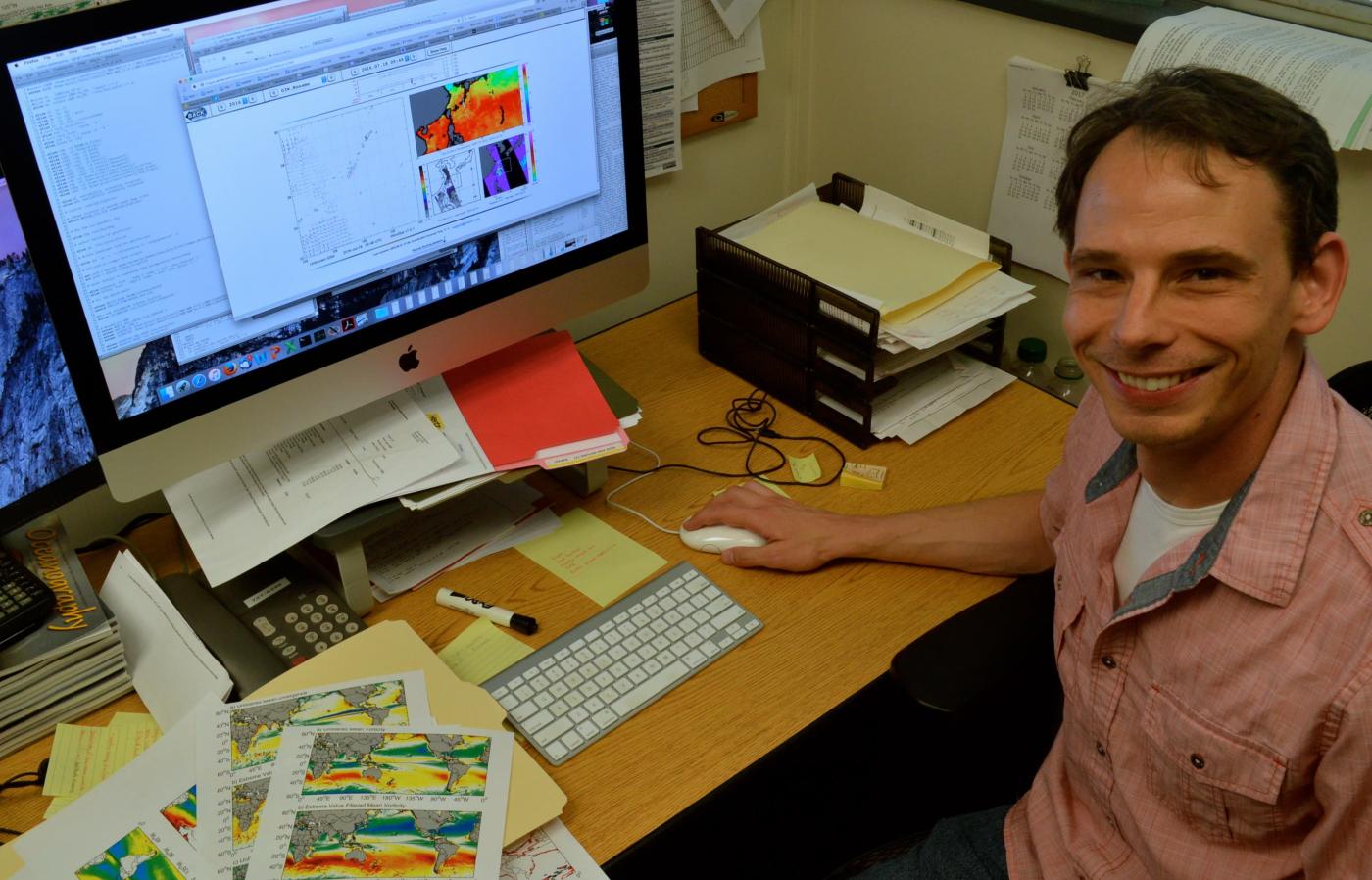 Larry O'Neill at his desk with a computer