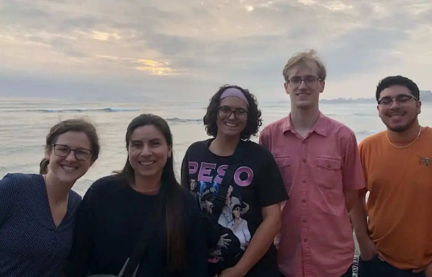 five people on the shore