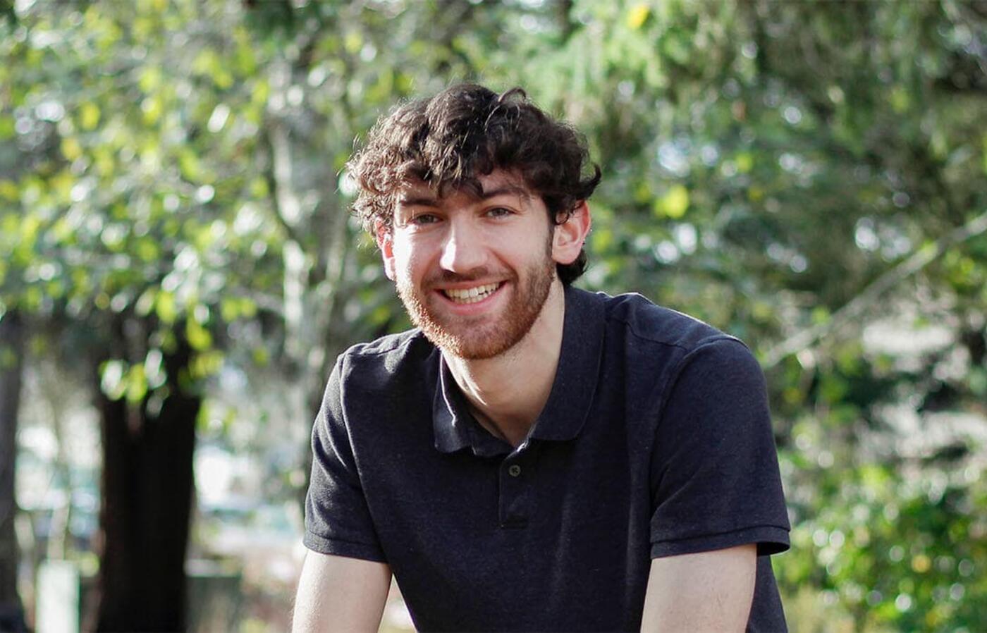 headshot of Tias Carney
