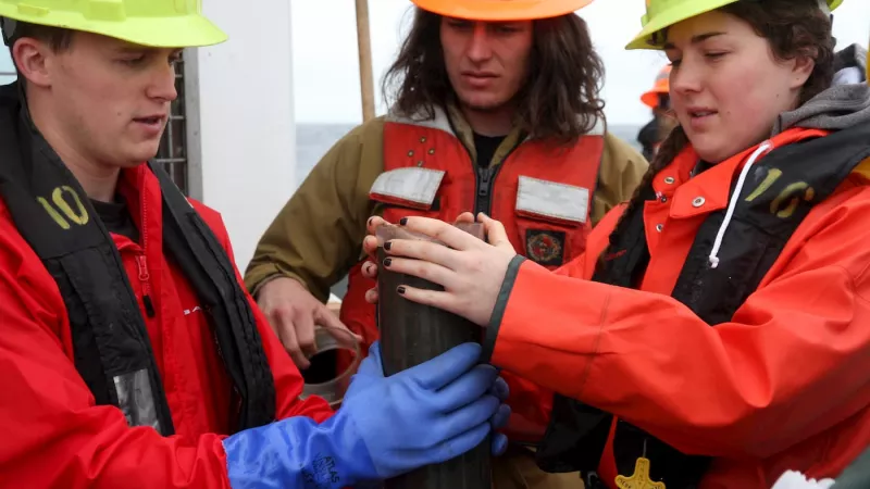 Students doing coring work aboard R/V Oceanus