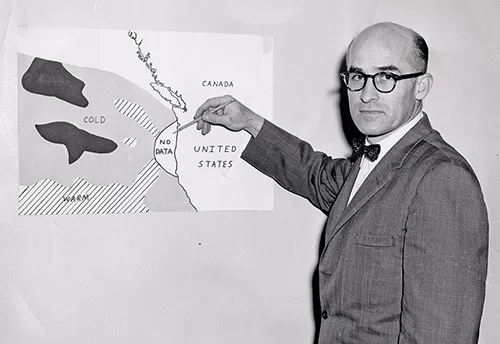 Wayne Burt pointing to a no-data area on a map