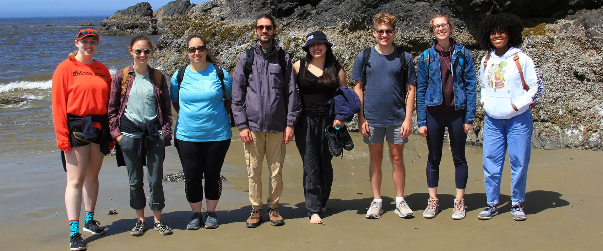 group shot of students on the shore