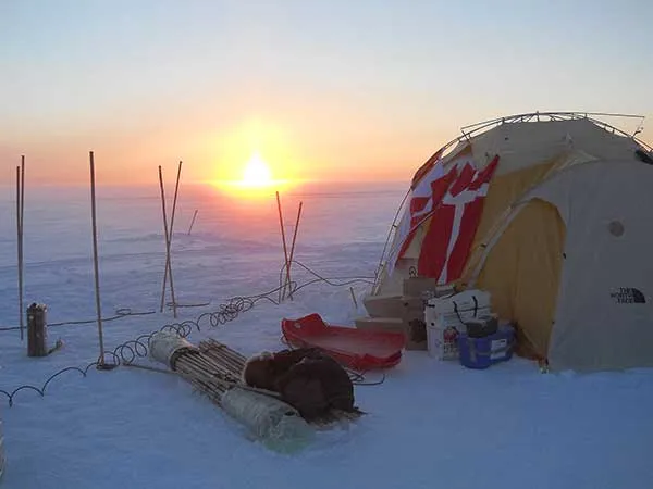 Sun, tent, ice and snow in Greenland