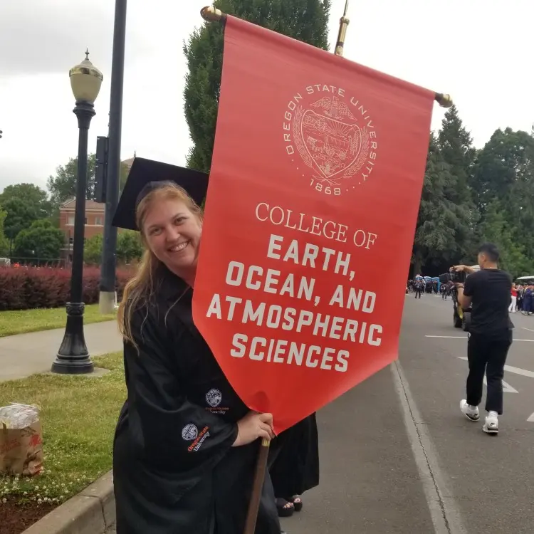 The College of Earth, Ocean, and Atmospheric Sciences flag at graduation
