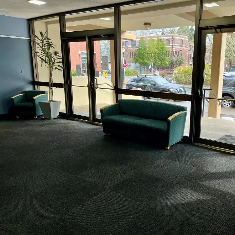 large window and a couch in the Wilkinson Hall lobby