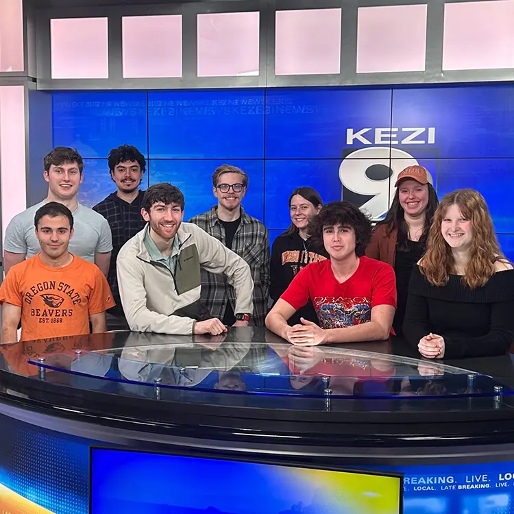 several students behind the desk in the KEZI 9 television studio