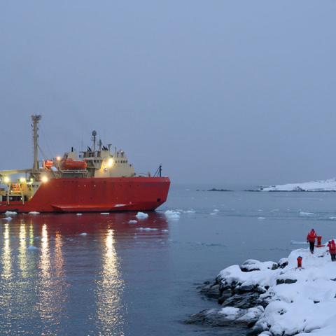 ship by the snowy shore