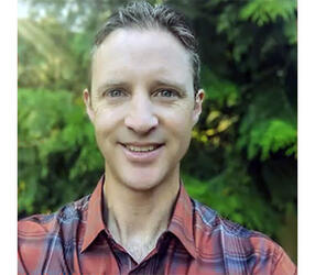 headshot of Craig Risien