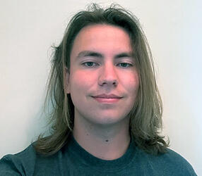 headshot of Adam Shokes
