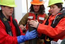 Students doing coring work aboard R/V Oceanus
